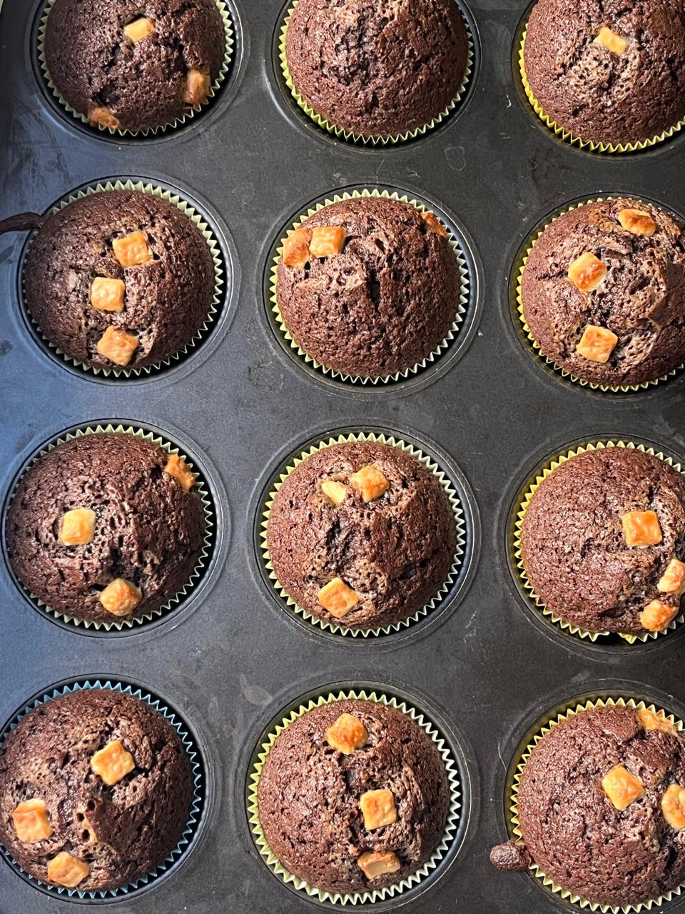 Finished chocolate muffins in a muffin tray